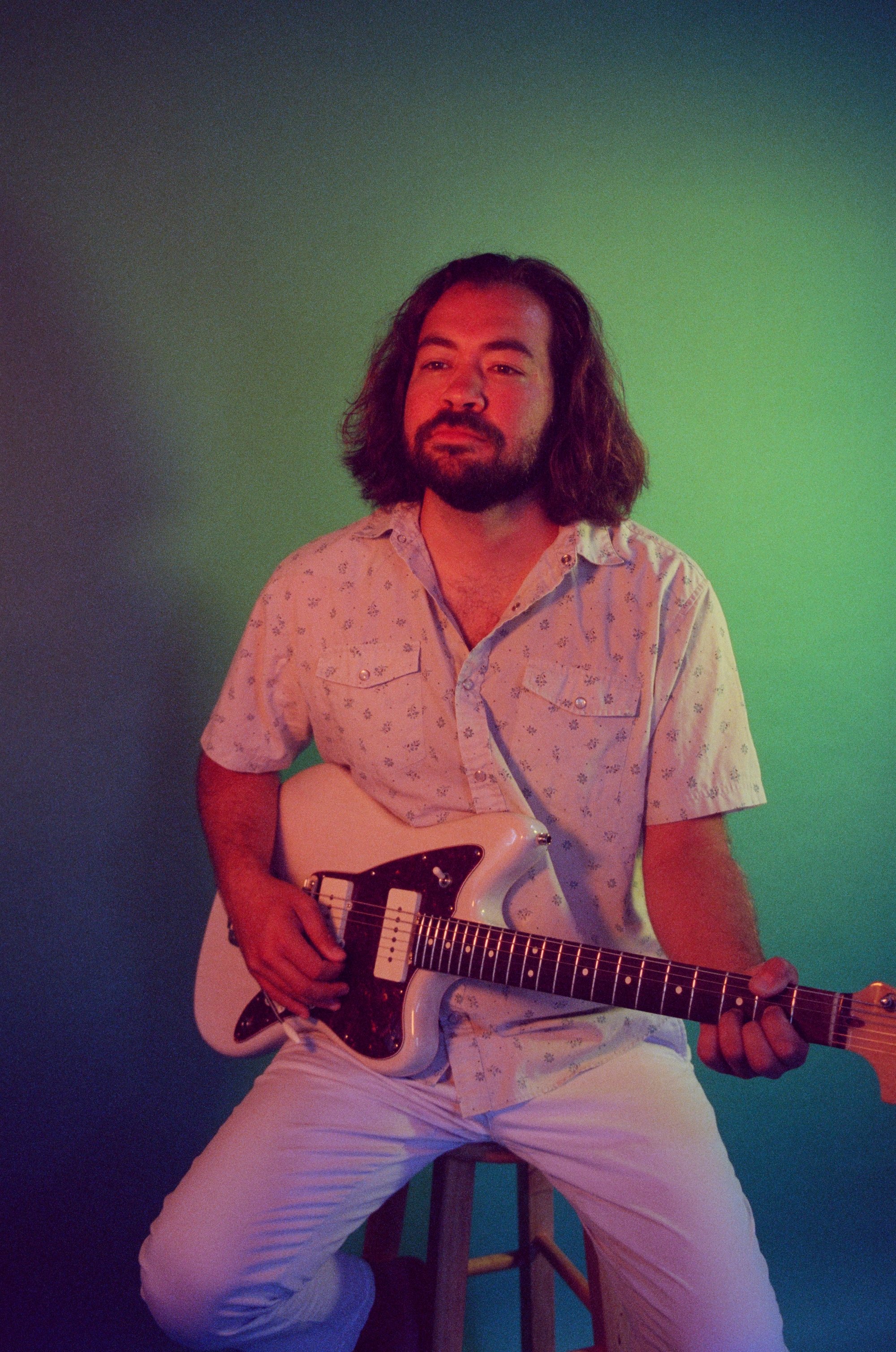 Alec Boyd playing an electric guitar