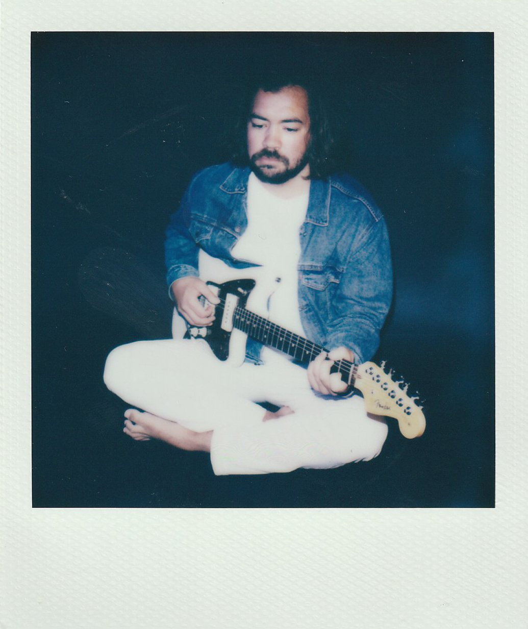 Alec Boyd with a guitar